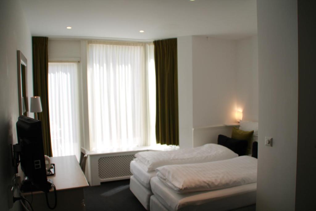 De Doelen Hotel เลเดน ห้อง รูปภาพ